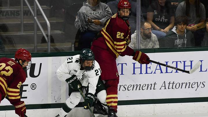 MSU's Red Savage moves the puck against Boston College's Dean Letourneau (20), Saturday, Oct. 12, 2024, at Munn Ice Arena in East Lansing. MSU won 4-3.