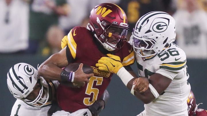 Green Bay Packers defensive end Micah Parsons (1) and linebacker Edgerrin Cooper sack Commanders quarterback Jayden Daniels. Green Bay Packers defensive end Micah Parsons (1) and linebacker Edgerrin Cooper sack Commanders quarterback Jayden Daniels.