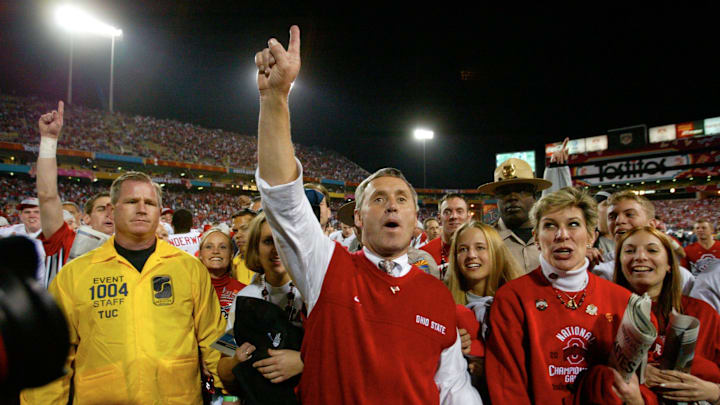 Ohio State's head football coach Jim Tressel celebrates after Ohio State beat the Miami Hurricanes in double overtime 31-24 at the BCS National Football Championships at the Sun Devil Stadium in Tempe, Arizona, January 3, 2003.