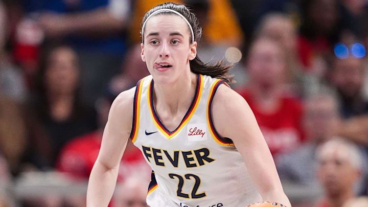 Indiana Fever guard Caitlin Clark rushes up the court Friday, July 12, 2024, during the game at Gainbridge Fieldhouse in Indianapolis. The Indiana Fever defeated the Phoenix Mercury, 95-86.