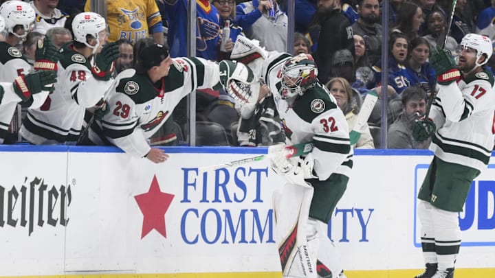 Oct 15, 2024; St. Louis, Missouri, USA; Minnesota Wild goaltender Filip Gustavsson (32) celebrates with goaltender Marc-Andre Fleury (29) after scoring a goal against the St. Louis Blues during the third period at Enterprise Center. Mandatory Credit: Jeff Le-Imagn Images