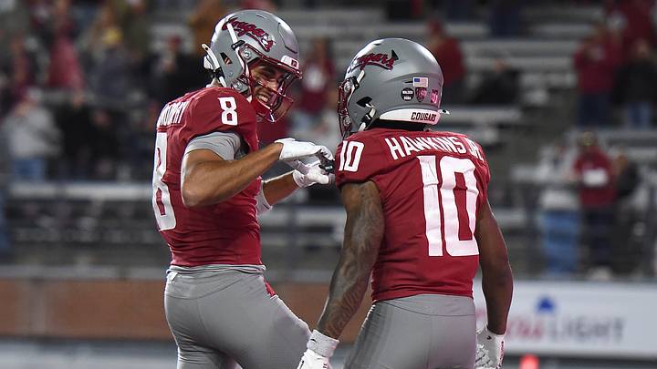 Washington State Cougars wide receiver Branden Ganashamoorthy (8) and Washington State Cougars wide receiver Tank Hawkins Jr. (10) celebrate a touchdown against the Arizona Wildcats during the second half at Gesa Field at Martin Stadium. Washington State Cougars wide receiver Branden Ganashamoorthy (8) and Washington State Cougars wide receiver Tank Hawkins Jr. (10) celebrate a touchdown against the Arizona Wildcats during the second half at Gesa Field at Martin Stadium.