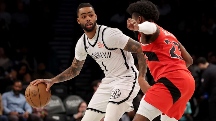 Mar 26, 2025; Brooklyn, New York, USA; Brooklyn Nets guard D'Angelo Russell (1) controls the ball against Toronto Raptors guard Jamal Shead (23) datory Credit: Brad Penner-Imagn Images Mar 26, 2025; Brooklyn, New York, USA; Brooklyn Nets guard D'Angelo Russell (1) controls the ball against Toronto Raptors guard Jamal Shead (23) datory Credit: Brad Penner-Imagn Images
