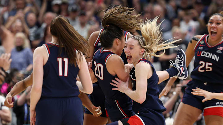 Bueckers celebrates with her teammates after UConn's national championship win. 