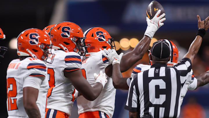 Aug 30, 2025; Atlanta, Georgia, USA; Syracuse Orange defensive lineman David Reese (8) celebrates after a fumble recovery against the Tennessee Volunteers in the first quarter at Mercedes-Benz Stadium. Mandatory Credit: Brett Davis-Imagn Images Aug 30, 2025; Atlanta, Georgia, USA; Syracuse Orange defensive lineman David Reese (8) celebrates after a fumble recovery against the Tennessee Volunteers in the first quarter at Mercedes-Benz Stadium. Mandatory Credit: Brett Davis-Imagn Images