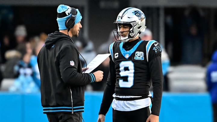Dec 22, 2024; Charlotte, North Carolina, USA; Carolina Panthers head coach Dave Canales with quarterback Bryce Young (9) in the fourth quarter at Bank of America Stadium. Mandatory Credit: Bob Donnan-Imagn Images