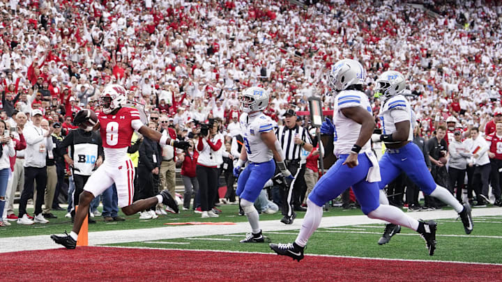 Sep 6, 2025; Madison, Wisconsin, USA;  Wisconsin Badgers wide receiver Vinny Anthony II (8) scores against the Middle Tennessee Blue Raiders during the second half at Camp Randall Stadium. Mandatory Credit: Kayla Wolf-Imagn Images