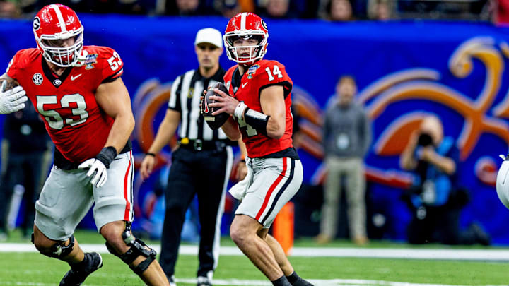 Jan 2, 2025; New Orleans, LA, USA; Georgia Bulldogs quarterback Gunner Stockton (14) makes a pass during the second quarter against the Notre Dame Fighting Irish at Caesars Superdome. Mandatory Credit: Stephen Lew-Imagn Images