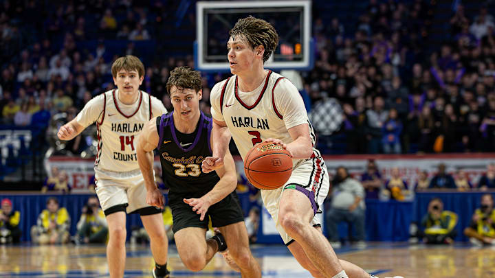 Harlan County's Trent Noah (2) drove to the basket in overtime as the Harlan County Black Bears