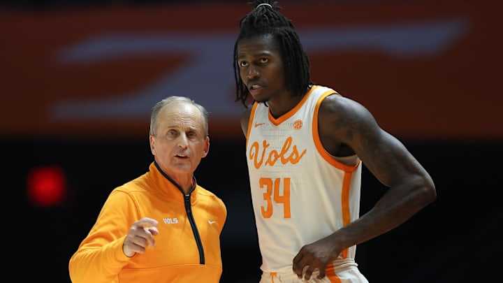 Dec 16, 2025; Knoxville, Tennessee, USA; Tennessee Volunteers head coach Rick Barnes speaks with center Felix Okpara (34) during the second half against the Louisville Cardinals at Thompson-Boling Arena at Food City Center. Mandatory Credit: Randy Sartin-Imagn Images Dec 16, 2025; Knoxville, Tennessee, USA; Tennessee Volunteers head coach Rick Barnes speaks with center Felix Okpara (34) during the second half against the Louisville Cardinals at Thompson-Boling Arena at Food City Center. Mandatory Credit: Randy Sartin-Imagn Images
