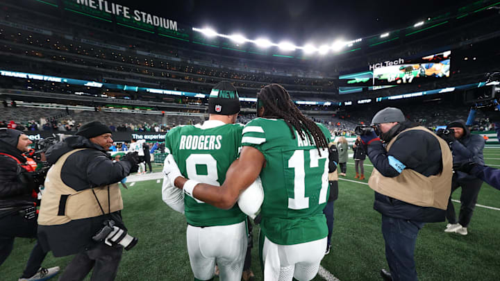 Jan 5, 2025; East Rutherford, New Jersey, USA; New York Jets quarterback Aaron Rodgers (8) and wide receiver Davante Adams (17) walk on the field after the Jets win over the Miami Dolphins at MetLife Stadium. Mandatory Credit: Ed Mulholland-Imagn Images Jan 5, 2025; East Rutherford, New Jersey, USA; New York Jets quarterback Aaron Rodgers (8) and wide receiver Davante Adams (17) walk on the field after the Jets win over the Miami Dolphins at MetLife Stadium. Mandatory Credit: Ed Mulholland-Imagn Images