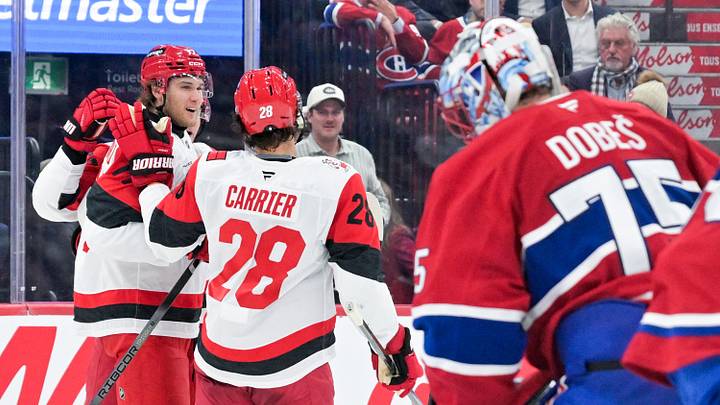 Oct 6, 2026; Montreal, Quebec, CAN;  Carolina Hurricanes forward Mark Jankowski (77) celebrates after scoring a goal against Montreal Canadiens goalie Jakub Dobes (75) during the second period at the Bell Centre.  Mandatory Credit: Eric Bolte-Imagn Images