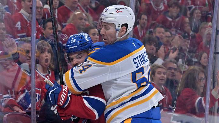 May 10, 2026; Montreal, Quebec, CAN; Buffalo Sabres defenseman Logan Stanley (64) checks Montreal Canadiens forward Alex Newhook (15) during the first period in game three of the second round of the 2026 Stanley Cup Playoffs at the Bell Centre. Mandatory Credit: Eric Bolte-Imagn Images May 10, 2026; Montreal, Quebec, CAN; Buffalo Sabres defenseman Logan Stanley (64) checks Montreal Canadiens forward Alex Newhook (15) during the first period in game three of the second round of the 2026 Stanley Cup Playoffs at the Bell Centre. Mandatory Credit: Eric Bolte-Imagn Images
