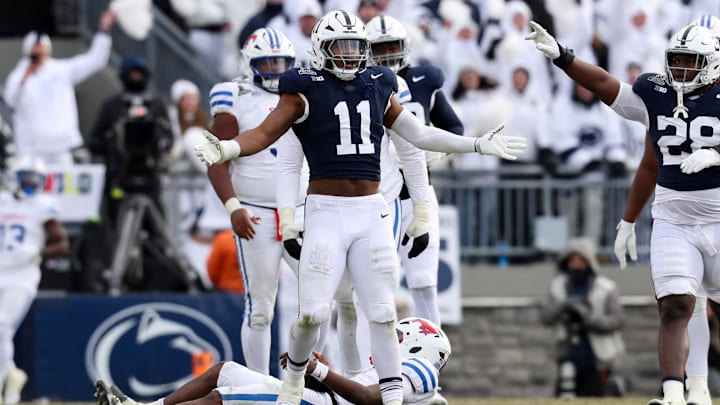 Dec 21, 2024; University Park, Pennsylvania, USA; Penn State Nittany Lions defensive end Abdul Carter (11) reacts after sacking Southern Methodist Mustangs quarterback Kevin Jennings (7) during the third quarter in the first round of the College Football Playoff at Beaver Stadium. Mandatory Credit: Matthew O'Haren-Imagn Images