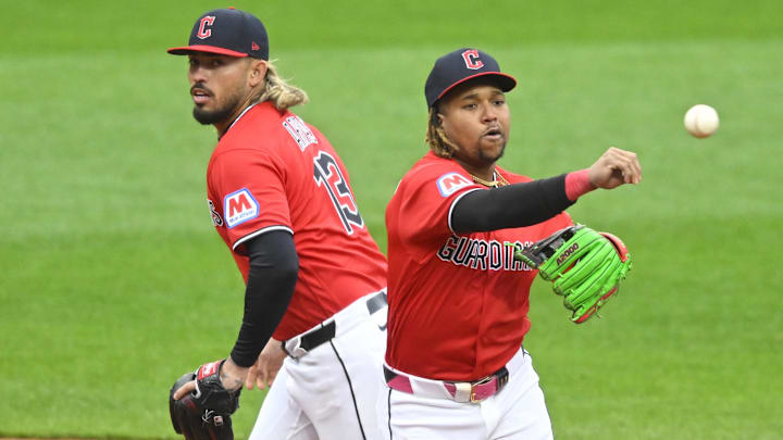 Apr 5, 2026; Cleveland, Ohio, USA; Cleveland Guardians third baseman Jose Ramirez (11) throws to first base beside shortstop Gabriel Arias (13) in the fifth inning against the Chicago Cubs at Progressive Field. Mandatory Credit: David Richard-Imagn Images