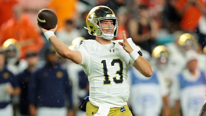 Aug 31, 2025; Miami Gardens, Florida, USA; Notre Dame Fighting Irish quarterback CJ Carr (13) drops back to pass against the Miami Hurricanes during the first quarter at Hard Rock Stadium. Mandatory Credit: Sam Navarro-Imagn Images