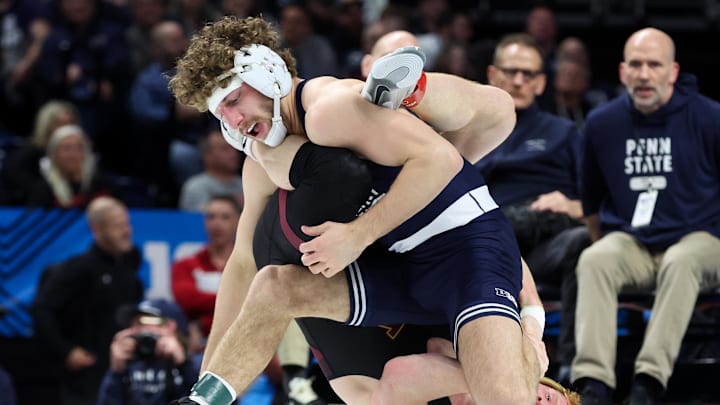 Penn State’s Mitchell Mesenbrink (top) wrestles Minnesota’s Andrew Sparks in a 165-pound bout during the semifinals of the Big Ten Wrestling Championships at Bryce Jordan Center. 