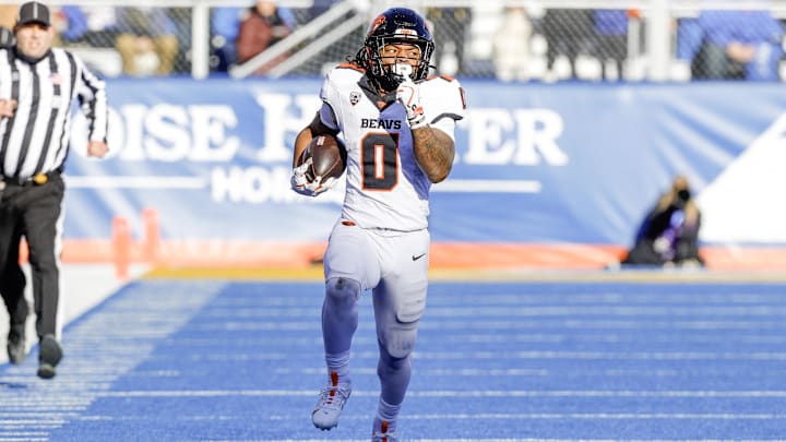 Nov 29, 2024; Boise, Idaho, USA; Oregon State Beavers running back Anthony Hankerson (0) runs for an 83 yard touchdown during the second quarter against the Boise State Broncos at Albertsons Stadium. Mandatory Credit: Brian Losness-Imagn Images