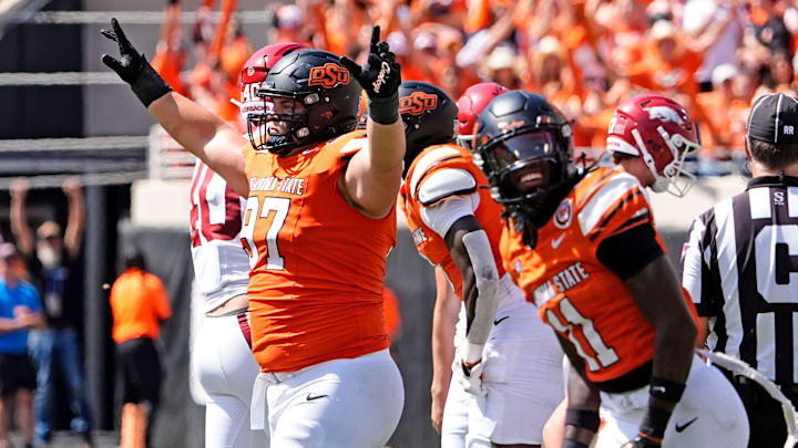 Oklahoma State's Justin Kirkland (97) celebrates a missed field goal by Arkansas in the first over time of the college football game between the Oklahoma State Cowboys and the Arkansas Razorbacks at Boone Pickens Stadium in Stillwater, Okla.,, Saturday, Sept., 7, 2024.
