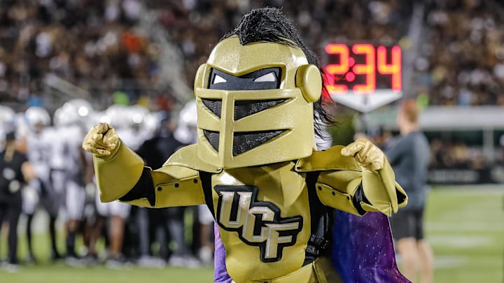 Oct 22, 2021; Orlando, Florida, USA; UCF Knights mascot Knightro preform for the fans during a time out against the Memphis Tigers during the second half at Bounce House. Mandatory Credit: Mike Watters-Imagn Images Oct 22, 2021; Orlando, Florida, USA; UCF Knights mascot Knightro preform for the fans during a time out against the Memphis Tigers during the second half at Bounce House. Mandatory Credit: Mike Watters-Imagn Images
