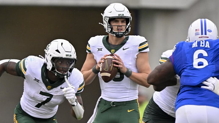 Sep 6, 2025; Dallas, Texas, USA; Baylor Bears quarterback Sawyer Robertson (13) looks to pass the ball against the SMU Mustangs during the second quarter at Gerald J. Ford Stadium. Mandatory Credit: Jerome Miron-Imagn Images