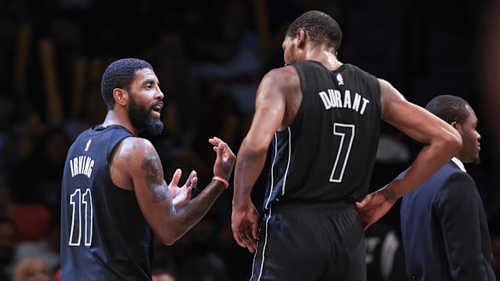 Oct 31, 2022; Brooklyn, New York, USA; Brooklyn Nets guard Kyrie Irving (11) talks with forward Kevin Durant (7) during the second half against the Indiana Pacers at Barclays Center. Mandatory Credit: Vincent Carchietta-Imagn Images