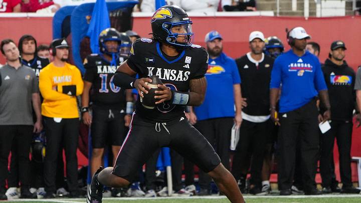 Oct 10, 2026; Salt Lake City, Utah, USA; Kansas Jayhawks quarterback Isaiah Marshall (8) drops back to pass during the first half against the Utah Utes at Rice-Eccles Stadium. Mandatory Credit: Aaron Baker-Imagn Images Oct 10, 2026; Salt Lake City, Utah, USA; Kansas Jayhawks quarterback Isaiah Marshall (8) drops back to pass during the first half against the Utah Utes at Rice-Eccles Stadium. Mandatory Credit: Aaron Baker-Imagn Images