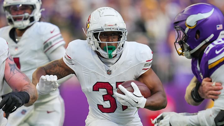 Dec 1, 2024; Minneapolis, Minnesota, USA; Arizona Cardinals running back Emari Demercado (31) runs with the ball against the Minnesota Vikings in the third quarter at U.S. Bank Stadium. Mandatory Credit: Brad Rempel-Imagn Images Dec 1, 2024; Minneapolis, Minnesota, USA; Arizona Cardinals running back Emari Demercado (31) runs with the ball against the Minnesota Vikings in the third quarter at U.S. Bank Stadium. Mandatory Credit: Brad Rempel-Imagn Images