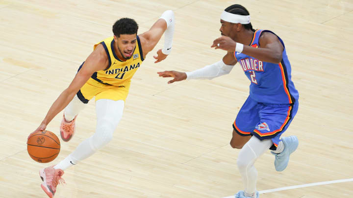 Jun 19, 2025; Indianapolis, Indiana, USA; Indiana Pacers guard Tyrese Haliburton (0) drives to the basket against Oklahoma City Thunder guard Shai Gilgeous-Alexander (2) in the first quarter during game six of the 2025 NBA Finals at Gainbridge Fieldhouse. Mandatory Credit: Trevor Ruszkowski-Imagn Images