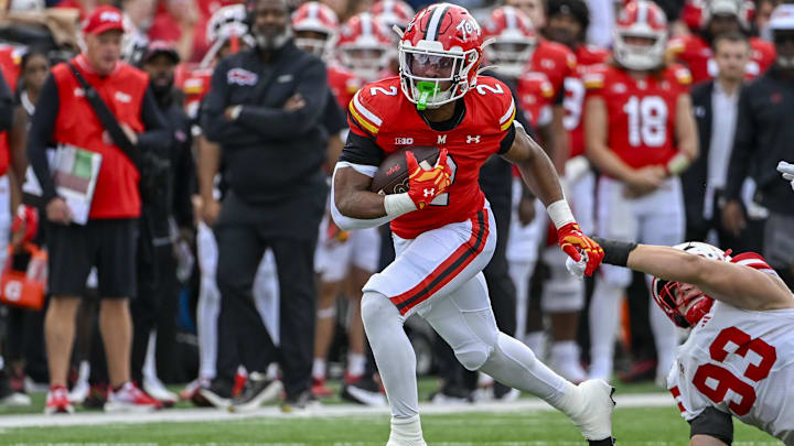 Oct 11, 2025; College Park, Maryland, USA;  Maryland Terrapins running back Nolan Ray (2) run through Nebraska Cornhuskers defensives lineman Kade Pietrzak (93) tackle attempt for a touchdown during the first half at SECU Stadium. Mandatory Credit: Tommy Gilligan-Imagn Images