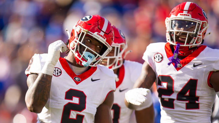 Georgia Bulldogs linebacker Smael Mondon Jr. (2) celebrates his tackle of Florida Gators running back Trevor Etienne (7) at Everbank Stadium in Jacksonville, FL on Saturday, October 28, 2023. [Doug Engle/Gainesville Sun]