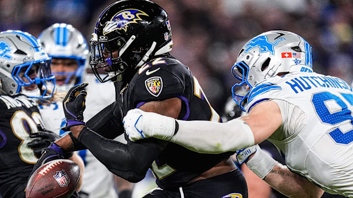 Detroit Lions defensive end Aidan Hutchinson (97) forces Baltimore Ravens running back Derrick Henry (22) to fumble during the second half at M&T Bank Stadium in Baltimore, Md. on Monday, Sept. 22, 2025.