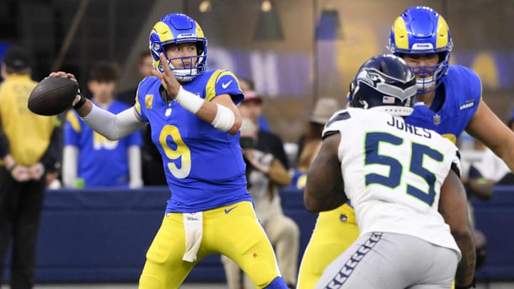 Nov 19, 2023; Inglewood, California, USA;  Los Angeles Rams quarterback Matthew Stafford (9) passes in the fourth quarter against the Seattle Seahawks at SoFi Stadium. Mandatory Credit: Robert Hanashiro-Imagn Images