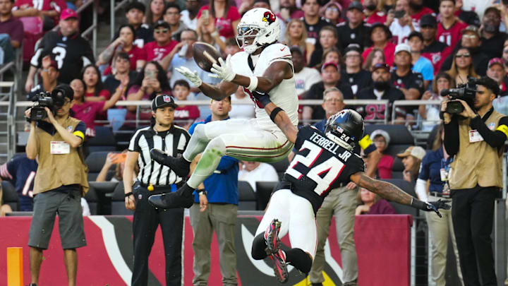 Dec 21, 2025; Glendale, Arizona, USA;  Arizona Cardinals wide receiver Marvin Harrison Jr. (18) is unable to make the reception as Atlanta Falcons cornerback A.J. Terrell Jr. (24) defends on the play during the second half at State Farm Stadium. Mandatory Credit: Joe Camporeale-Imagn Images