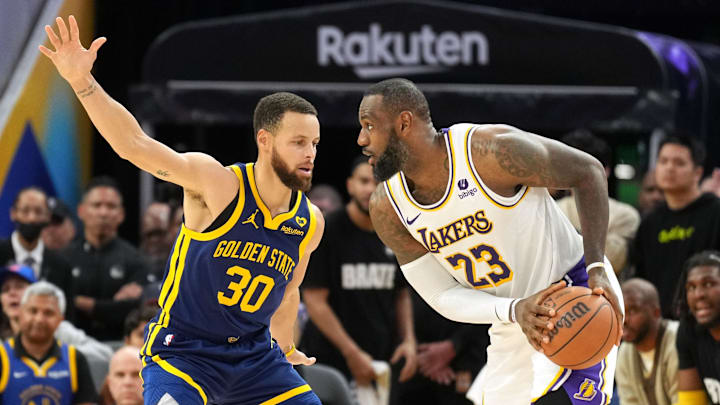 Los Angeles Lakers forward LeBron James (23) handles the ball against Golden State Warriors guard Stephen Curry (30) during overtime at Chase Center. Mandatory Credit: Darren Yamashita-Imagn Images Los Angeles Lakers forward LeBron James (23) handles the ball against Golden State Warriors guard Stephen Curry (30) during overtime at Chase Center. Mandatory Credit: Darren Yamashita-Imagn Images