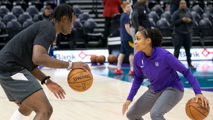 Oct 26, 2019; Salt Lake City, UT, USA; Sacramento Kings assistant player development coach Lindsey Harding (right) works with forward Caleb Swanigan (left) prior to a game against the Utah Jazz at Vivint Smart Home Arena. Mandatory Credit: Russ Isabella-USA TODAY Sports Oct 26, 2019; Salt Lake City, UT, USA; Sacramento Kings assistant player development coach Lindsey Harding (right) works with forward Caleb Swanigan (left) prior to a game against the Utah Jazz at Vivint Smart Home Arena. Mandatory Credit: Russ Isabella-USA TODAY Sports