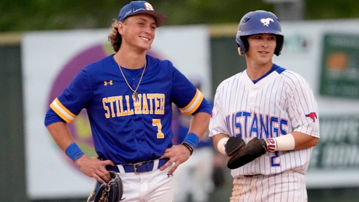 Fort Cobb-Broxton's Eli Willits talks with Stillwater's Ethan Holliday during the high school baseball game between Fort Cobb-Broxton and Stillwater at Edmond Santa Fe High School in Edmond, Okla., Friday, April, 18, 2025.