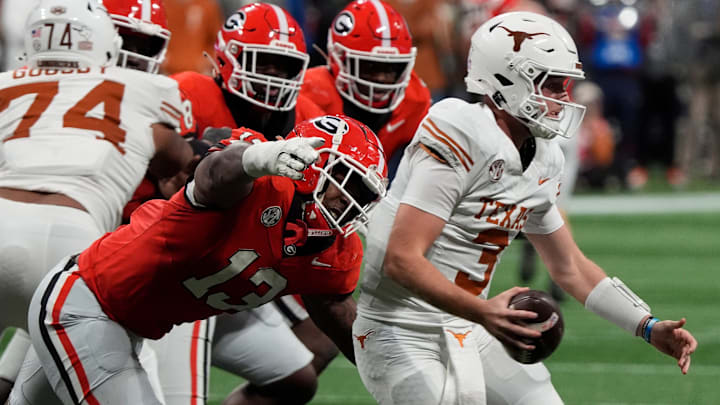 Georgia defensive lineman Mykel Williams (13) goes in for a sack on Texas quarterback Quinn Ewers (3) during the second half of the SEC championship game against Texas in Atlanta, on Saturday, Dec. 7, 2024.