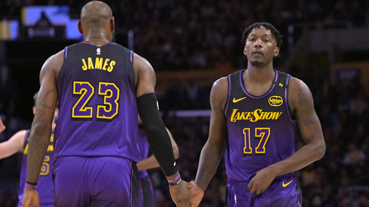 Jan 2, 2025; Los Angeles, California, USA;  Los Angeles Lakers forward Dorian Finney-Smith (17) subs into the game for forward LeBron James (23) in the first half against the Portland Trail Blazers at Crypto.com Arena. Mandatory Credit: Jayne Kamin-Oncea-Imagn Images