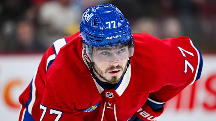 Feb 8, 2025; Montreal, Quebec, CAN; Montreal Canadiens center Kirby Dach (77) waits for a face-off against the New Jersey Devils during the second period at Bell Centre. Mandatory Credit: David Kirouac-Imagn Images