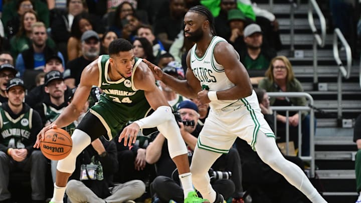 Nov 10, 2024; Milwaukee, Wisconsin, USA;  Milwaukee Bucks forward Giannis Antetokounmpo (34) is guarded by Boston Celtics forward Jaylen Brown (7) in the fourth quarter at Fiserv Forum. Mandatory Credit: Benny Sieu-Imagn Images