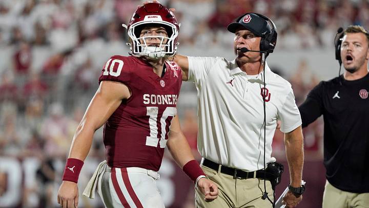 Oklahoma quarterback John Mateer (10) and coach Brent Venables talk after a play during Saturday's game between the Sooners and New Mexico at Gaylord Family-Oklahoma Memorial Stadium in Norman, Okla. Oklahoma won 14-6. Oklahoma quarterback John Mateer (10) and coach Brent Venables talk after a play during Saturday's game between the Sooners and New Mexico at Gaylord Family-Oklahoma Memorial Stadium in Norman, Okla. Oklahoma won 14-6.