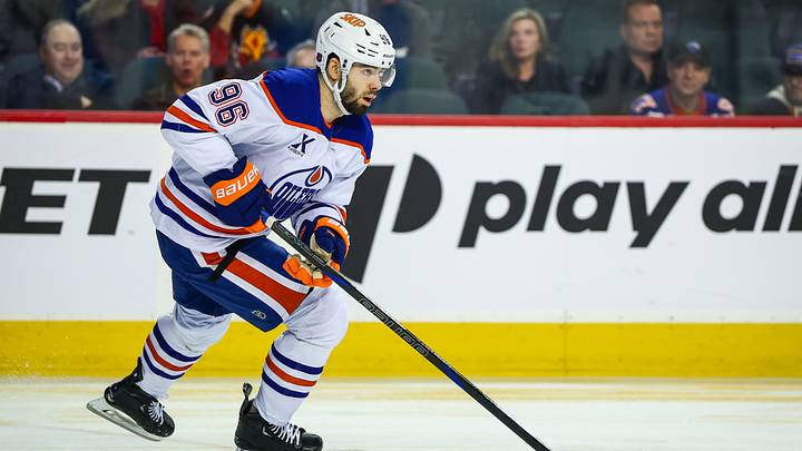 Feb 4, 2026; Calgary, Alberta, CAN; Edmonton Oilers defenseman Jake Walman (96) skates with the puck against the Calgary Flames during the second period at Scotiabank Saddledome. Mandatory Credit: Sergei Belski-Imagn Images