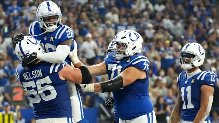 Indianapolis Colts players celebrate Indianapolis Colts running back Ameer Abdullah (26) after Abdullah scores a touchdown Sunday, Oct. 5, 2025, during a game at Lucas Oil Stadium in Indianapolis. The Colts defeated the Raiders 40-6.