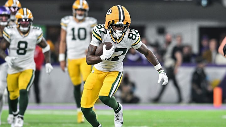 Dec 29, 2024; Minneapolis, Minnesota, USA; Green Bay Packers wide receiver Romeo Doubs (87) gets yards after the catch against the Minnesota Vikings during the fourth quarter at U.S. Bank Stadium. Mandatory Credit: Jeffrey Becker-Imagn Images