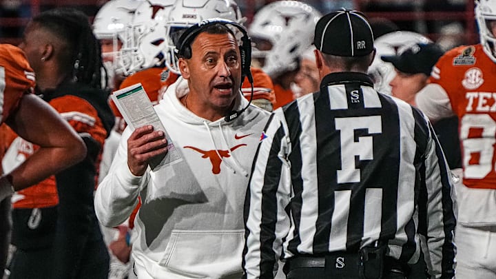 Dec 21, 2024; Austin, Texas, USA; Texas Longhorns head coach Steve Sarkisian disputes a call against the Clemson Tigers in the first round of the College Football Playoffs at Darrell K Royal-Texas Memorial Stadium. Mandatory Credit: Aaron E. Martinez/USA Today Network via Imagn Images