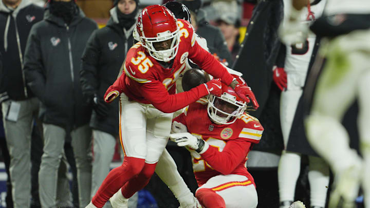 Kansas City Chiefs cornerback Jaylen Watson and safety Justin Reid break up a pass intended for Houston Texans wide receiver Nico Collins.