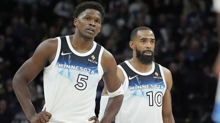 Minnesota Timberwolves guards Anthony Edwards (5) and Mike Conley watch as a member of the Atlanta Hawks shoots free throws in the fourth quarter at Target Center in Minneapolis on Jan. 27, 2025.