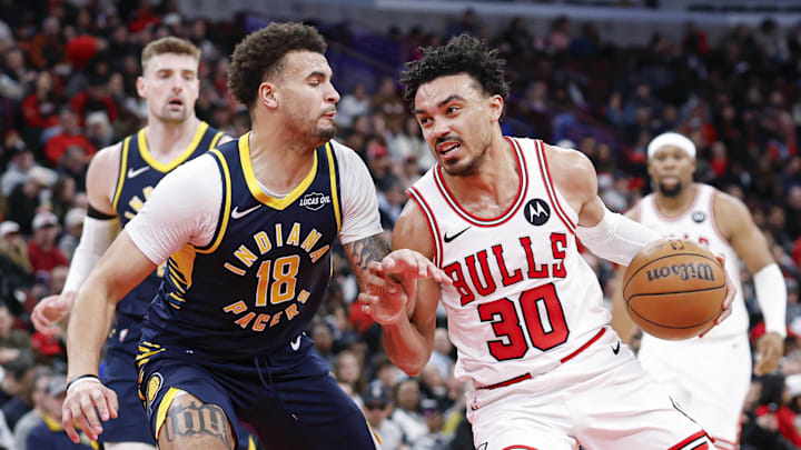 Apr 1, 2026; Chicago, Illinois, USA; Chicago Bulls guard Tre Jones (30) drives to the basket against Indiana Pacers forward Jalen Slawson (18) during the second half at United Center. Mandatory Credit: Kamil Krzaczynski-Imagn Images