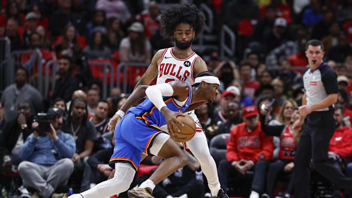 Oklahoma City Thunder guard Shai Gilgeous-Alexander (2) drives to the basket against Chicago Bulls guard Coby White (0) during the first half at United Center. Mandatory Credit: Kamil Krzaczynski-Imagn Images